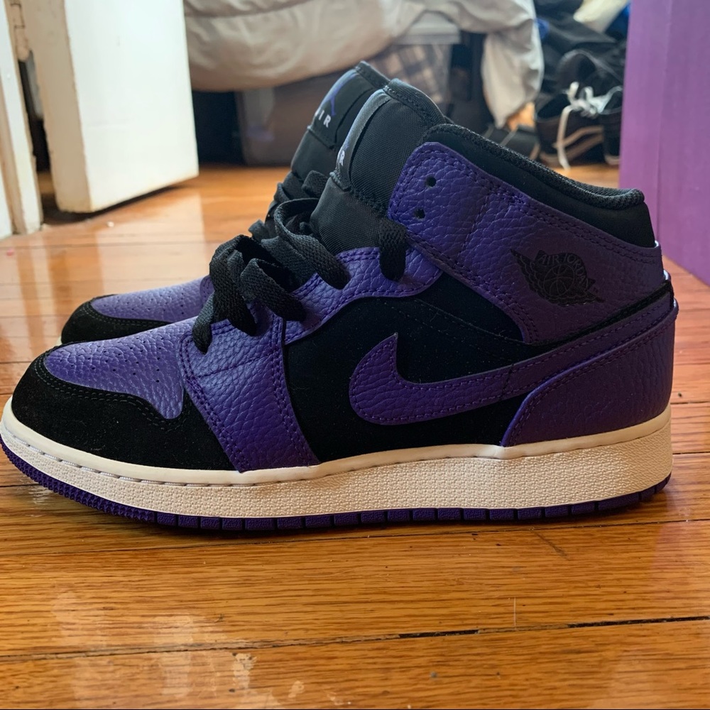 Black and purple Jordan 1s